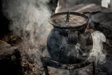 Cast iron cooking pot simmers; Ejido Hidalgo, San Luis, Mexico