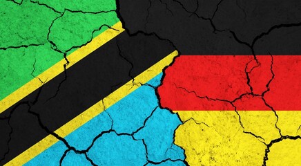 Flags of Tanzania and Germany on cracked surface - politics, relationship concept