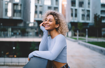 Smiling woman standing in urban district