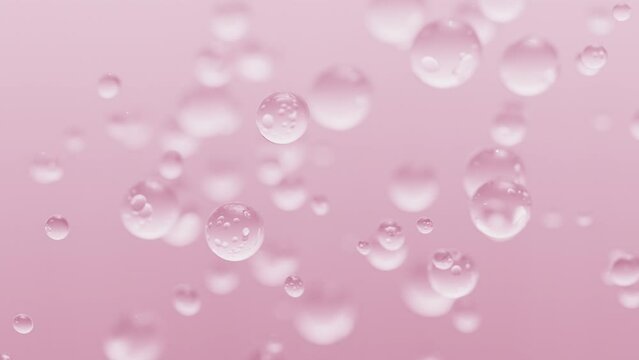 Close up rising up bubbles pink color on pink background