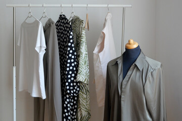 dummy and modern woman clothing, clothes rack, large wardrobe with different clothes, home stuff,...