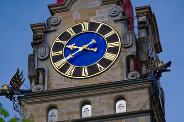 Close-up of church tower with clock face of protestant church at the old town of Swiss City of Winterthur on a cloudy spring day. Photo taken May 17th, 2023, Winterthur, Switzerland.