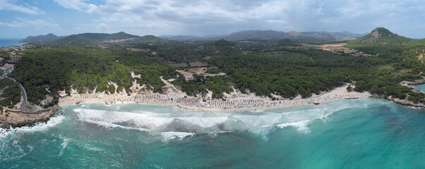 Aerial view of Cala Agulla beach in Mallorca, Spain, on a hot summer day
