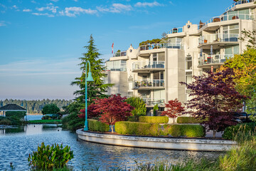 Modern apartment buildings with nice pond BC Canada. Residential district, ornamental pool of...