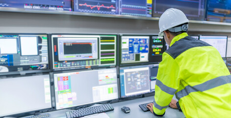 Engineer working at control room,Manager control system,Technician man monitoring program from a...