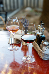 Glasses of rose and red wine on dinner table