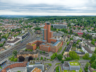 Aerial view of Swiss City of Winterthur with buildings, streets and scenic landscape on a cloudy...