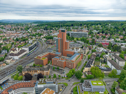 Aerial view of Swiss City of Winterthur with buildings, streets and scenic landscape on a cloudy spring morning. Photo taken May 17th, 2023, Winterthur, Switzerland.