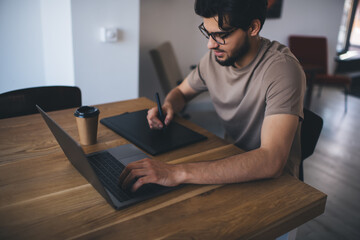 Young designer working on tablet