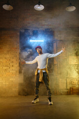Fototapeta na wymiar Contemporary hip hop freestyle dancer posing for camera