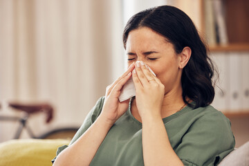 Sick, allergy and blowing nose with woman on sofa for virus, hayfever or illness. Healthcare,...
