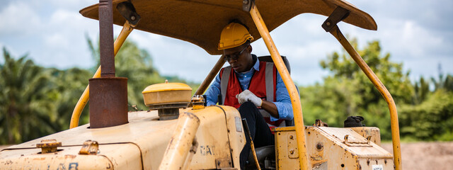 Black people worker in helmet on site construction, Excavator bulldozer male worker, Construction...