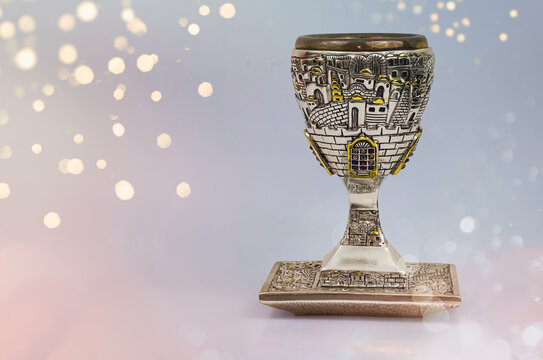 Silver kiddush wine cup and saucer isolated. Shabbat silver kiddush cup. Kiddush cup with the gemstone of 12 tribes.