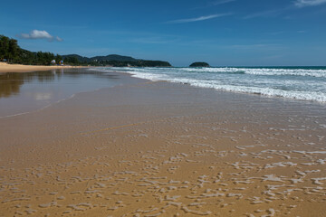 Fototapeta na wymiar Beautiful beach on a summer day. Blue sky. Sunny day. Yellow sand on the beach.