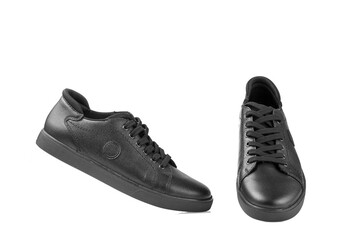 black leather sneakers on a white background