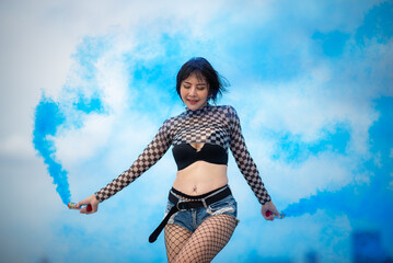 Beautiful Asian female hip hop dancer striking a sexy dance pose, attractive sexy dancer women...