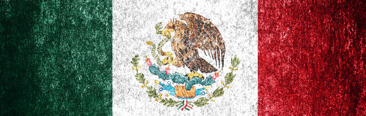 Grunge mexican flag close up. Dirty flag of Mexico on a metal surface.