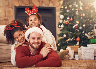 Christmas, portrait and happy family in house on floor, bonding and together. Xmas, smile and face...