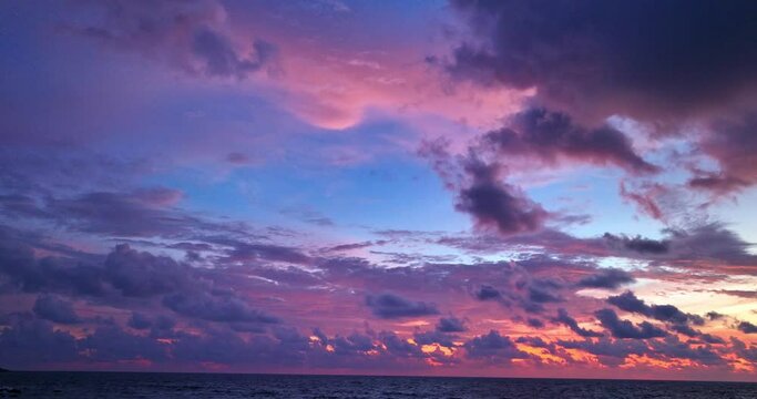 .Scene of romantic sky with purple cloud cover the ocean at sunset..beautiful purple sky at sunset in nature and travel concept..sunset landscape Amazing light of nature cloudscape sky background.