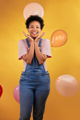 Balloons, wow and happy woman on birthday, prize or giveaway success, winning and celebration. Party, excited and young african person or gen z winner, competition or sale on yellow studio background