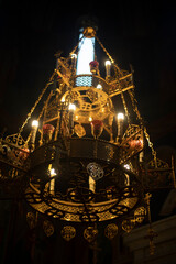 Golden chandelier in temple. Interior of Orthodox Church. Large antique chandelier.