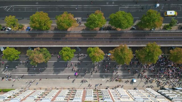 Smooth aerial top view flight drone. CSD Pride Love Parade 2023 in city Berlin