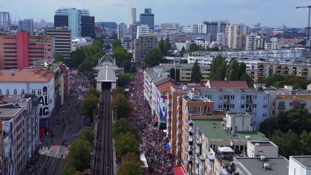 Dramatic aerial top view flight drone. CSD Pride Love Parade 2023 in city Berlin