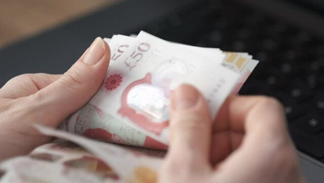 Unrecognizable Woman Counting Money. Financial  and Economical Concept. Close Up Shot of  American Official Currency Dollar. Indoor Shot 4K.