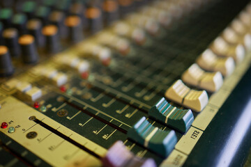 View of music mixer in concert, filled with lights.