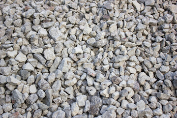 Crushed rocky, granite. Crushed stone construction. Middle fraction of stone building stone.Background, texture.