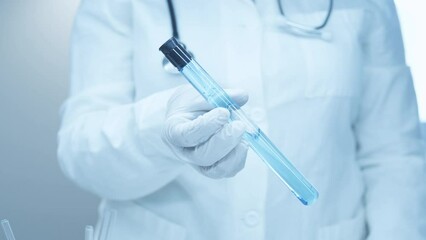 The test tube with a blue reagent. Chemical reactions. Scientific experiment. Blue liquid into the flask. Chemical substances. Acid neutralization. Mixing with water in a test tubes. Laboratory. - Powered by Adobe