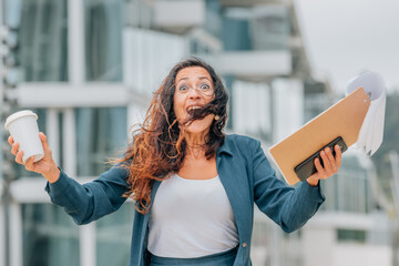 business woman in the street euphoric and excited celebrating success