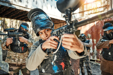Paintball team, gun and woman aim, focus and shooting at target practice, competition or military...