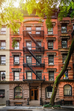 a row of brownstone buildings and in an iconic neighborhood of Manhattan, New York City.