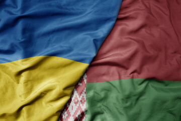 big waving national colorful flag of ukraine and national flag of belarus . © luzitanija
