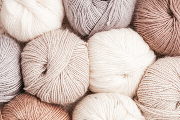 Craft knitting hobby background with yarn in natural colors. Recomforting hobby to reduce stress...