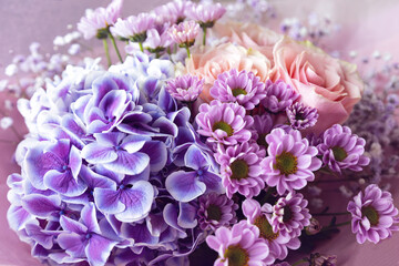 Bouquet with roses, gypsophila, chrysanthemum, hydrangea.