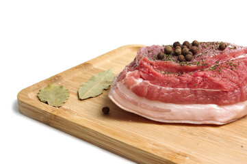 fresh pork belly on wooden board isolated on white background