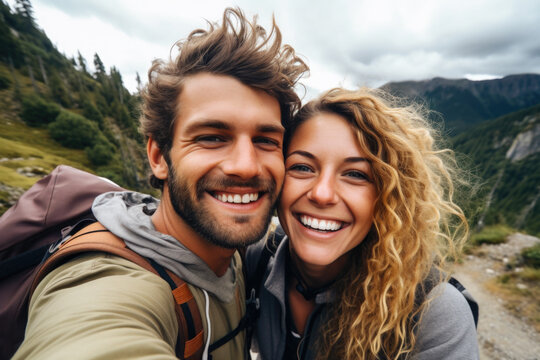 Selfie photo of happy smiling young couple during traveling together at beautiful destination in the mountains