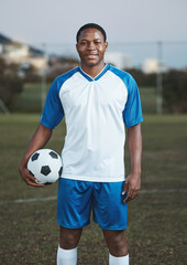 Soccer ball, ready or portrait of black man on field with smile in sports training, game or match on pitch. Happy football player, fitness or proud African athlete in practice, exercise or workout © Wesley JvR/peopleimages.com
