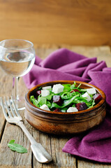 Arugula beet goat cheese salad in a bowl