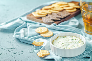 Parsley garlic warm ricotta cheese dip with crackers