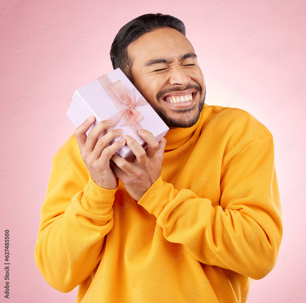 Canvas Prints Man, excited winner and gift box, birthday celebration and prize, giveaway or shopping on pink background. Happy person with present, ribbon package and retail sale or competition love in studio