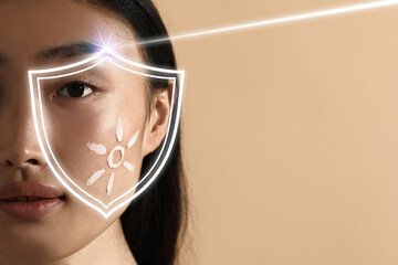 Sun protection care. Beautiful woman with sunscreen on face against beige background, space for...