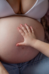 young beautiful pregnant woman with big belly, 9th month of pregnancy, motherhood, childbirth,...