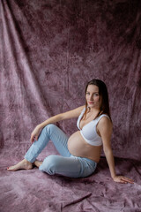 young beautiful pregnant woman with big belly, 9th month of pregnancy, motherhood, childbirth,...