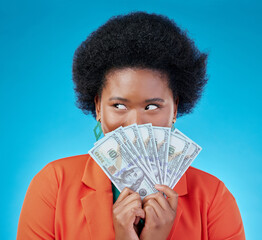 Cash, hide and a black woman lottery winner on a blue background in studio holding money for...