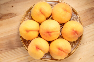 Fototapeta na wymiar Fresh Yellow Peach, Yellow Peach fruit on wooden background, 