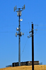 Communication and Electrical infrastructure. Isolated cell tower gets data from microwave where...