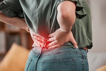 Red, back and pain of woman with injury problem, health risk or muscle inflammation at home....